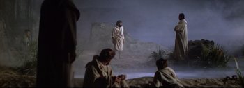Movie still from “The Greatest Story Ever Told” (1965), directed by David Lean – A man standing in the middle of a field; Wide shot, Low angle