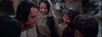 Movie still from “The Greatest Story Ever Told” (1965), directed by David Lean – A group of people standing next to each other; Close Up shot, Over the shoulder angle