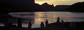 Movie still from “The Greatest Story Ever Told” (1965), directed by David Lean – A group of people sitting next to a body of water; Extreme Wide shot, High angle
