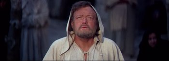 Movie still from “The Greatest Story Ever Told” (1965), directed by David Lean – An old man with a beard and a hood on; Close Up shot, Low angle