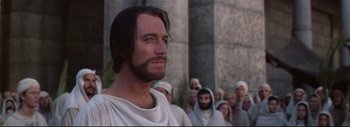 Movie still from “The Greatest Story Ever Told” (1965), directed by David Lean – A man with a long beard in front of a crowd; Close Up shot, Low angle