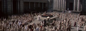 Movie still from “The Greatest Story Ever Told” (1965), directed by David Lean – A crowd of people gathered around a fire pit; Extreme Wide shot, High angle