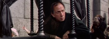 Movie still from “The Greatest Story Ever Told” (1965), directed by David Lean – An older man sitting in a chair looking at the camera; Close Up shot, Low angle