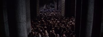 Movie still from “The Greatest Story Ever Told” (1965), directed by David Lean – A group of people standing in the dark; Extreme Wide shot, High angle
