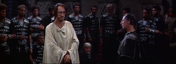 Movie still from “The Greatest Story Ever Told” (1965), directed by David Lean – A group of men standing next to each other; Medium shot, Over the shoulder angle