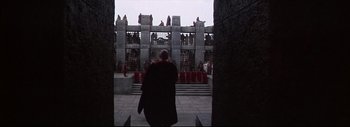 Movie still from “The Greatest Story Ever Told” (1965), directed by David Lean – A man wearing a black robe walking in front of a crowd; Extreme Wide shot, High angle
