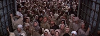 Movie still from “The Greatest Story Ever Told” (1965), directed by David Lean – A large group of people wearing head scarfs; Wide shot, High angle