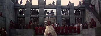 Movie still from “The Greatest Story Ever Told” (1965), directed by David Lean – A group of people standing in front of a building; Extreme Wide shot, High angle