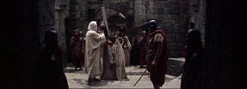 Movie still from “The Greatest Story Ever Told” (1965), directed by David Lean – A group of people dressed as roman legionnaires; Wide shot, High angle