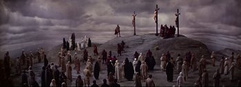 Movie still from “The Greatest Story Ever Told” (1965), directed by David Lean – A group of people standing on top of a hill; Extreme Wide shot, High angle