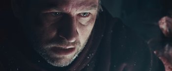 Movie still from “The Grey” (2011), directed by Joe Carnahan – A man's face in the snow; Extreme Close Up shot, Over the shoulder angle