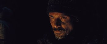 Movie still from “The Grey” (2011), directed by Joe Carnahan – A person wearing a hat; Close Up shot, Low angle