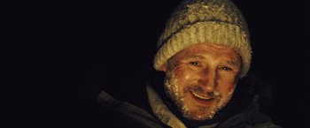 Movie still from “The Grey” (2011), directed by Joe Carnahan – A person wearing a hat; Extreme Close Up shot, Low angle