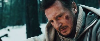 Movie still from “The Grey” (2011), directed by Joe Carnahan – A person wearing a jacket; Close Up shot, Low angle