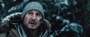 Movie still from “The Grey” (2011), directed by Joe Carnahan – A person wearing a hat; Close Up shot, Low angle