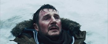 Movie still from “The Grey” (2011), directed by Joe Carnahan – A person wearing a jacket; Close Up shot, Low angle