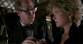 Movie still from “The Grifters” (1990), directed by Stephen Frears – A man and a woman looking at each other; Close Up shot, Over the shoulder angle