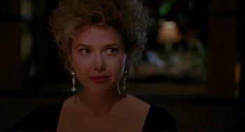 Movie still from “The Grifters” (1990), directed by Stephen Frears – A person wearing a dress; Close Up shot, Over the shoulder angle