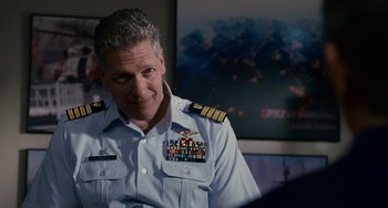 Movie still from “The Guardian” (2006), directed by Andrew Davis – A person wearing a military uniform; Medium shot, Over the shoulder angle