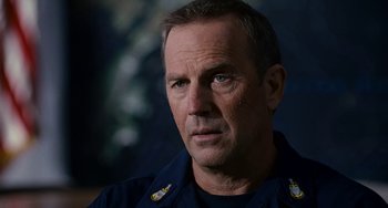 Movie still from “The Guardian” (2006), directed by Andrew Davis – A person wearing a police uniform; Close Up shot, Over the shoulder angle