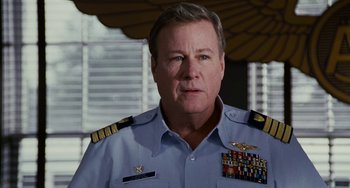 Movie still from “The Guardian” (2006), directed by Andrew Davis – A person wearing a military uniform; Close Up shot, Over the shoulder angle