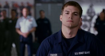 Movie still from “The Guardian” (2006), directed by Andrew Davis – A person wearing a uniform; Close Up shot, Low angle