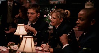 Movie still from “The Guardian” (2006), directed by Andrew Davis – A man and a woman sitting at a dinner table; Medium shot, Over the shoulder angle