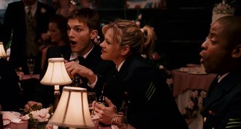 Movie still from “The Guardian” (2006), directed by Andrew Davis – A man and a woman sitting in front of a lamp; Medium shot, Over the shoulder angle