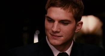 Movie still from “The Guardian” (2006), directed by Andrew Davis – A person wearing a suit and tie; Close Up shot, Over the shoulder angle