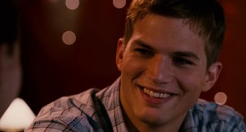 Movie still from “The Guardian” (2006), directed by Andrew Davis – A person smiling for the camera; Close Up shot, Over the shoulder angle