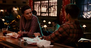 Movie still from “The Guardian” (2006), directed by Andrew Davis – Two people sitting at a table in front of each other; Medium shot, Over the shoulder angle