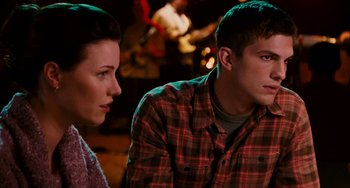 Movie still from “The Guardian” (2006), directed by Andrew Davis – A man and a woman sitting next to each other; Close Up shot, Over the shoulder angle