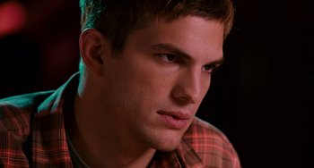 Movie still from “The Guardian” (2006), directed by Andrew Davis – A person with a plaid shirt; Close Up shot, Over the shoulder angle