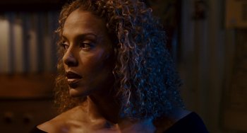 Movie still from “The Guardian” (2006), directed by Andrew Davis – A person with curly brown hair; Close Up shot, Over the shoulder angle