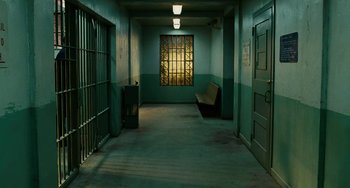 Movie still from “The Guardian” (2006), directed by Andrew Davis – A hallway with a bench and a window in it; Wide shot, High angle