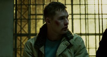Movie still from “The Guardian” (2006), directed by Andrew Davis – A young man with bruises on his face; Close Up shot, Low angle