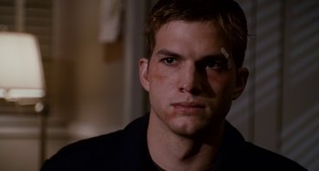 Movie still from “The Guardian” (2006), directed by Andrew Davis – A man with a bandage on his face; Close Up shot, Over the shoulder angle