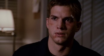 Movie still from “The Guardian” (2006), directed by Andrew Davis – A person with a bandage on his face; Close Up shot, Over the shoulder angle