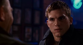 Movie still from “The Guardian” (2006), directed by Andrew Davis – A person wearing a jacket; Close Up shot, Over the shoulder angle