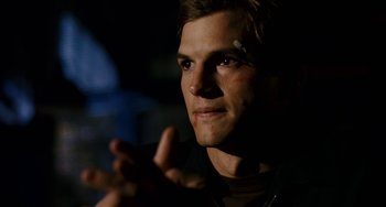 Movie still from “The Guardian” (2006), directed by Andrew Davis – A person wearing a black shirt; Close Up shot, Over the shoulder angle