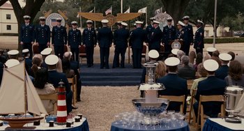 Movie still from “The Guardian” (2006), directed by Andrew Davis – A group of men standing in front of a cross; Wide shot, High angle