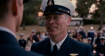 Movie still from “The Guardian” (2006), directed by Andrew Davis – A person wearing a uniform; Close Up shot, Over the shoulder angle