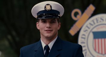 Movie still from “The Guardian” (2006), directed by Andrew Davis – A man in a uniform is wearing a hat; Close Up shot, Over the shoulder angle