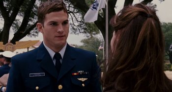 Movie still from “The Guardian” (2006), directed by Andrew Davis – A man in a military uniform talking to a woman; Medium shot, Over the shoulder angle