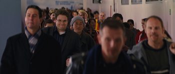 Movie still from “The Guilt Trip” (2012), directed by Anne Fletcher – A group of people standing in a room; Medium shot, Over the shoulder angle
