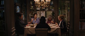 Movie still from “The Guilt Trip” (2012), directed by Anne Fletcher – A group of people sitting around a table eating; Wide shot, High angle