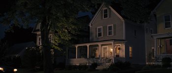 Movie still from “The Guilt Trip” (2012), directed by Anne Fletcher – A house that is lit up at night time; Wide shot, High angle