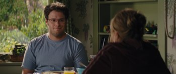 Movie still from “The Guilt Trip” (2012), directed by Anne Fletcher – A man and a woman are sitting at a table; Medium shot, Over the shoulder angle