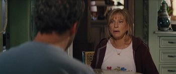 Movie still from “The Guilt Trip” (2012), directed by Anne Fletcher – A woman sitting at a table with a man; Close Up shot, Over the shoulder angle