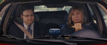 Movie still from “The Guilt Trip” (2012), directed by Anne Fletcher – A man and a woman sitting in the back seat of a car; Close Up shot, Over the shoulder angle